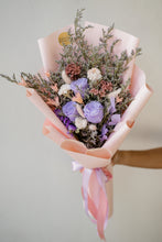 Load image into Gallery viewer, Bouquet of flowers with pink paper wrap and ribbons on a light background