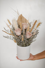 Load image into Gallery viewer, Top view of the flower arrangement, showing the careful placement of blush roses, pampas, and bleached accents.