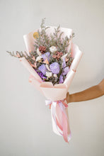 Load image into Gallery viewer, Bouquet of flowers with pink ribbons held against a plain background

