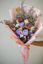 Load image into Gallery viewer, Bouquet of flowers wrapped in pink paper with a blurred background
