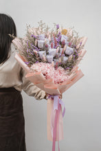 Load image into Gallery viewer, A detailed view of the preserved roses, highlighting the vibrant lilac and soft pink petals, nestled among the delicate texture of the hydrangeas.
