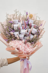 Handcrafted preserved rose bouquet in lilac and pink for timeless elegance.