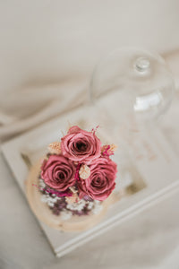 dried and preserved flowers artfully arranged in a glass