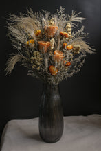Load image into Gallery viewer, Warm and cozy arrangement of dried flowers in a black vase on a dark background
