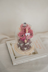 dried and preserved flowers artfully arranged in a glass