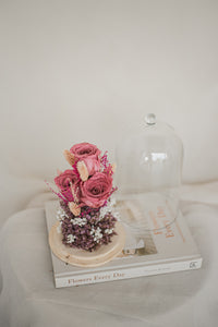 dried and preserved flowers artfully arranged in a glass