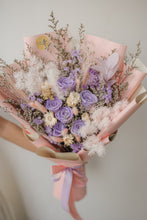 Load image into Gallery viewer, Bouquet of flowers with pink and purple tones held against a neutral background
