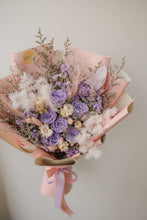 Load image into Gallery viewer, Bouquet of flowers with purple and white colors held by a hand against a plain background
