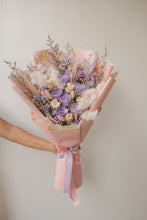 Load image into Gallery viewer, Bouquet of flowers wrapped in pink paper with a ribbon against a neutral background
