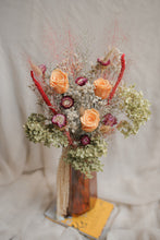 Load image into Gallery viewer, Vase arrangement of dried flowers in a vase on a textured surface.
