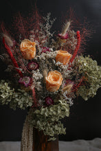 Load image into Gallery viewer, Close-up shot of dried flowers with orange roses and greenery against a dark background.
