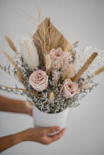 Load image into Gallery viewer, Front view of a blush pink and bleached white dried flower arrangement in a ceramic pot.
